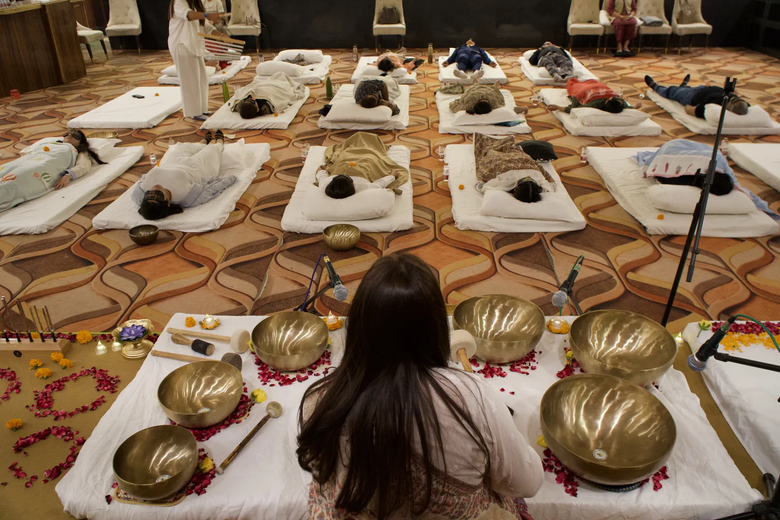 A group sound bath with singing bowls