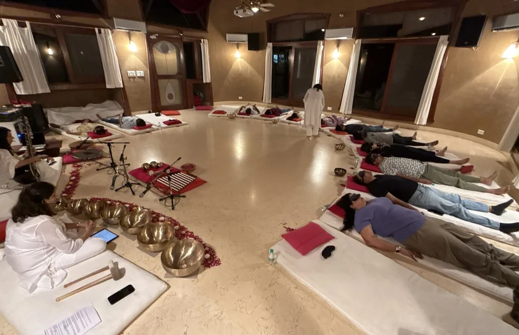 Guests resting in a circle during a sound journey